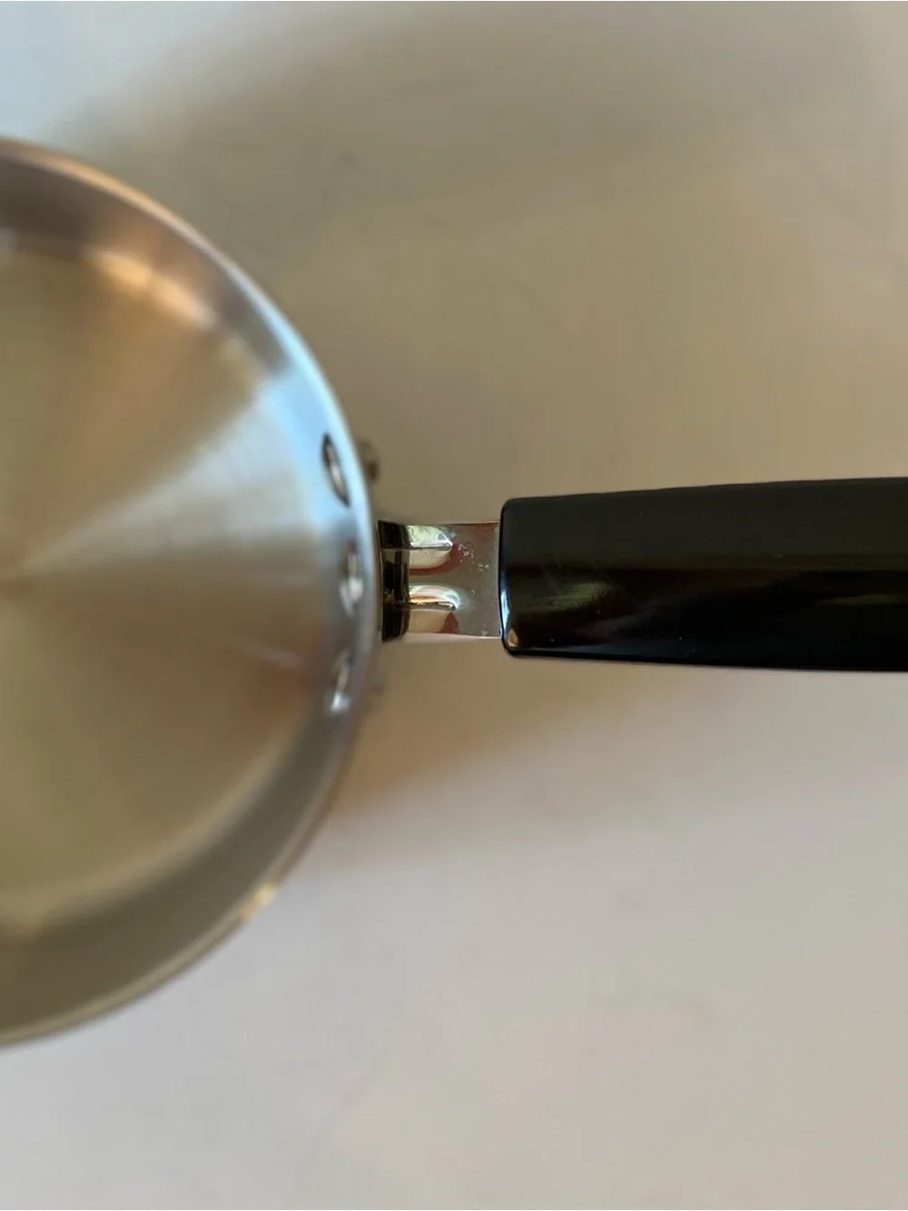 Stainless Steel Saucepan with Black Handle and Lid